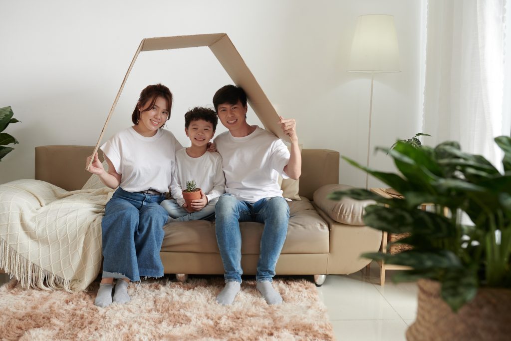 Family under Cardboard Roof